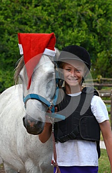 Christmas pony with little girl rider