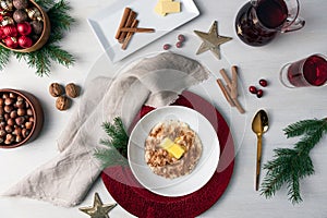 Christmas porridge norwegian style with cinnamon, sugar and melted butter in the middle.