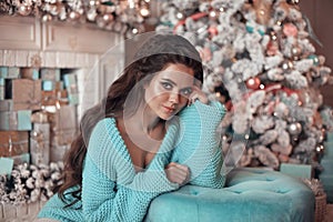 Christmas Portrait of Beautiful brunette girl wears in turquoise