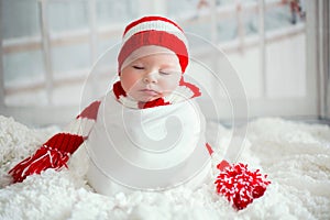 Christmas portrait of cute little newborn baby boy, wearing santa hat