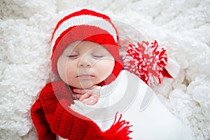 Christmas portrait of cute little newborn baby boy, wearing santa hat