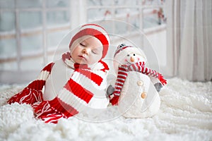 Christmas portrait of cute little newborn baby boy, wearing santa hat