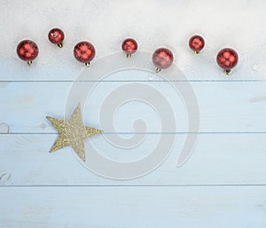 Christmas postcard with red balls and a decorative yellow star