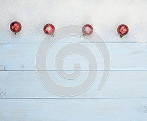 Christmas postcard with red balls and snow