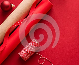 Christmas preparation, boxing day and holidays gift giving, xmas craft paper and ribbons for gifts boxes on red