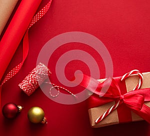 Christmas preparation, boxing day and holidays gift giving, xmas craft paper and ribbons for gifts boxes on red