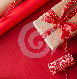 Christmas preparation, boxing day and holidays gift giving, xmas craft paper and ribbons for gifts boxes on red