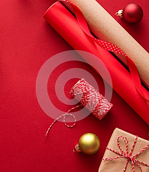 Christmas preparation, boxing day and holidays gift giving, xmas craft paper and ribbons for gifts boxes on red