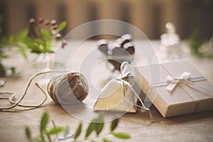 Christmas preparattions. Shiny silver bag and white box closeup