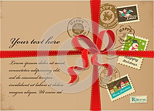Christmas present box with colorful stamps red ribbons