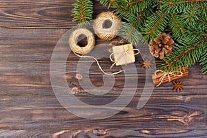Christmas present box. fir branches with cinnamon and anise on rustic wooden background. flat lay. seasonal greetings concept. win