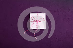 Christmas present concept - white gift box with twine wedged on