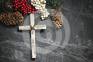 Christmas present and cross with pine cones