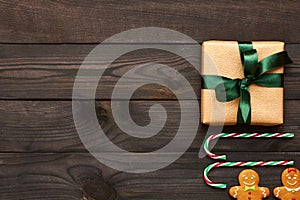 Christmas present and decoration on wooden background