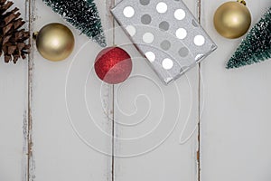 Christmas present or gift box on white wooden background