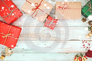 Christmas present gifts box and snow on wooden background
