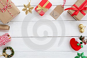 Christmas present gifts boxes and decoration elements on white wooden background.