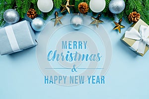 Christmas present and pine tree with xmas decoration on blue background