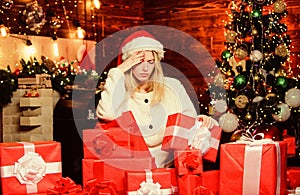Christmas present. serious girl red santa hat. last preparation. Christmas time. celebrate new year at home. xmas