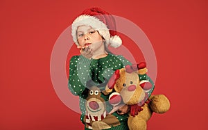 Christmas present. small santa kid red background. little girl present toy. winter holiday shopping. time for presents