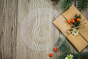 Christmas present wrapped in kraft paper with natural decoration. Flat lay, top view