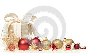 Christmas present with xmas bubbles and ribbon isolated on white background