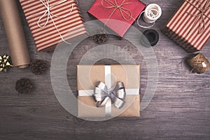 Christmas presents gift red and rustic decorated laid on wooden table background