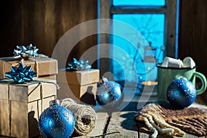 Christmas presents on old wooden table.