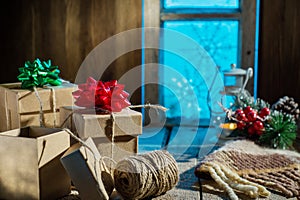 Christmas presents on old wooden table.