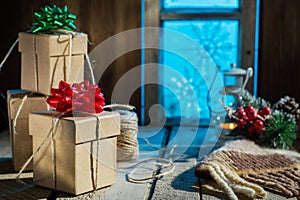 Christmas presents on old wooden table.