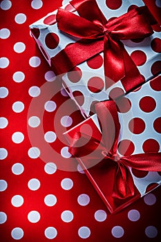 Christmas presents on polka-dot red textile holidays concept