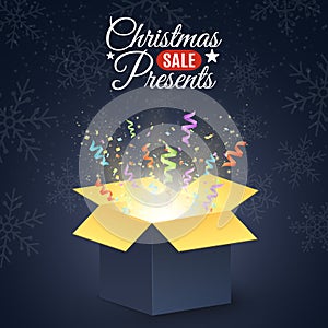 Christmas presents. Poster for the christmas sale. Open dark gift box. Confetti and colorful multicolored ribbons. Christmas prese