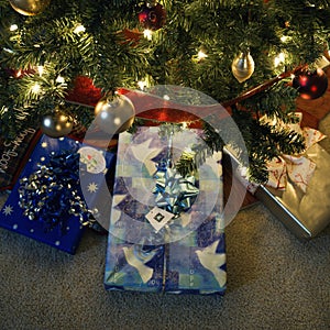 Christmas presents under tree.