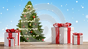 Christmas presents on wooden floor with blurred snowflakes and green fir tree background 3d-illustration