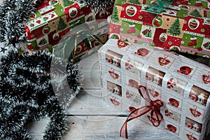 Christmas presents wrapped in green, red and white paper, decorated with ribbons