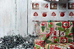 Christmas presents wrapped in green, red and white paper, decorated with ribbons