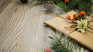 Christmas presents wrapped in kraft paper with natural decoration. Angle view