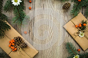 Christmas presents wrapped in kraft paper with natural decoration. Flat lay, top view