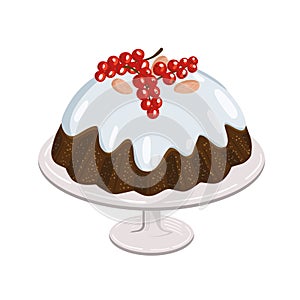 Christmas pudding with berries and almonds, traditional sweet dish glazed with sugar icing.