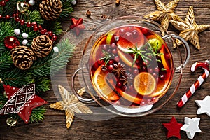 Christmas punch. Festive rChristmas mulled wine punch. Festive red ed hot toddy cocktail, drink with cranberries and citrus fruits