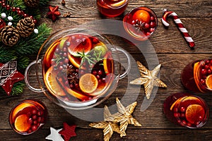 Christmas punch. Festive red hot toddy cocktail, drink with cranberries and citrus fruits