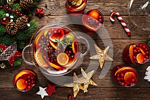 Christmas punch. Festive red hot toddy cocktail, drink with cranberries and citrus fruits