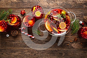 Christmas punch. Festive red hot toddy cocktail, drink with cranberries and citrus fruits