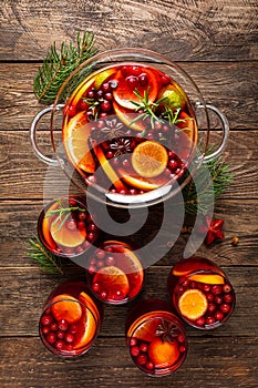 Christmas punch. Festive red hot toddy cocktail, drink with cranberries and citrus fruits