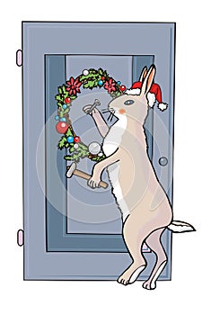 Christmas rabbit nails a wreath to the door