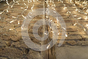 Christmas rain lights on handmade block wall in Sardinia