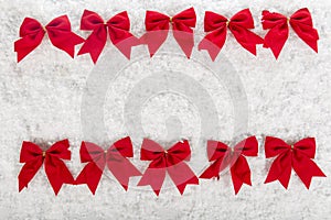 Christmas red bow on a background of white