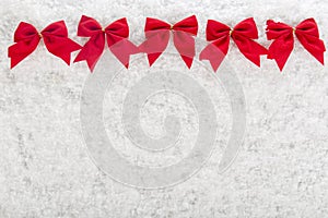 Christmas red bow on a background of white