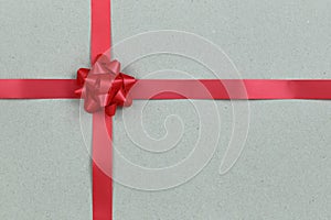 Christmas Red Bow and ribbon on brown paper background