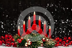 Christmas red candle lights bridge, red berries of left and right site and Christmas green round wreath colored